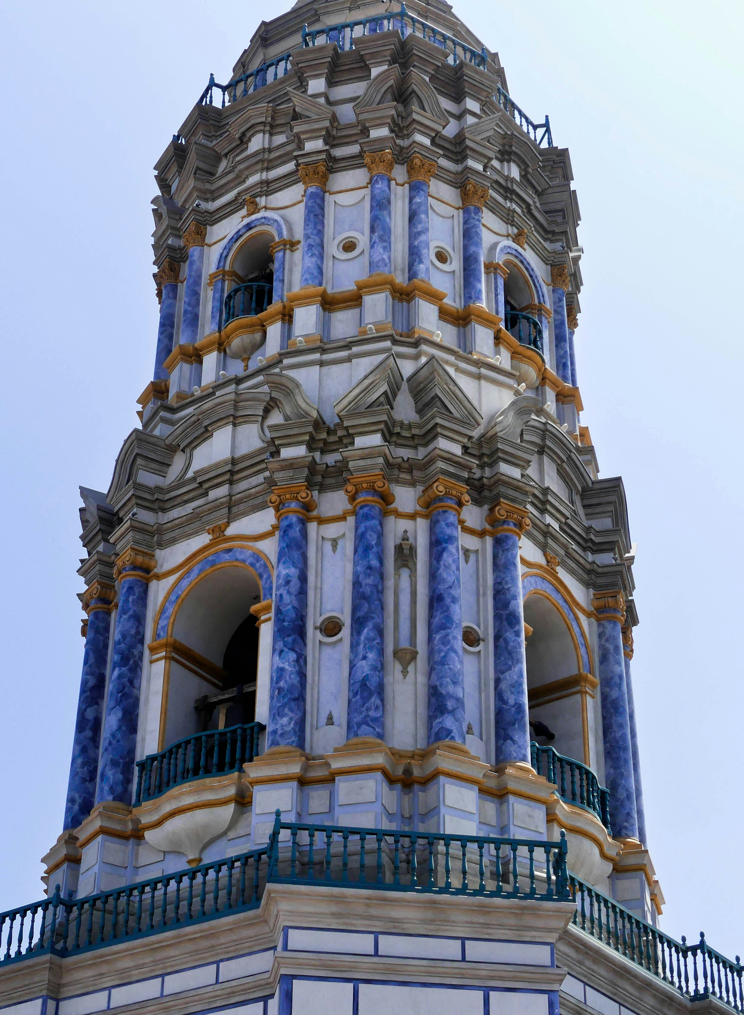 a tall tower with a clock on the top of it