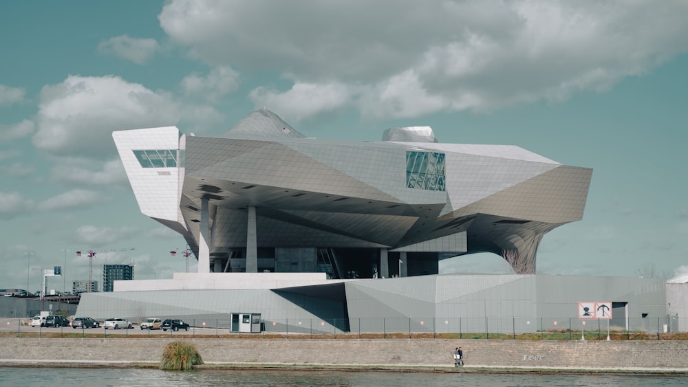 a large building with a large body of water in front of it