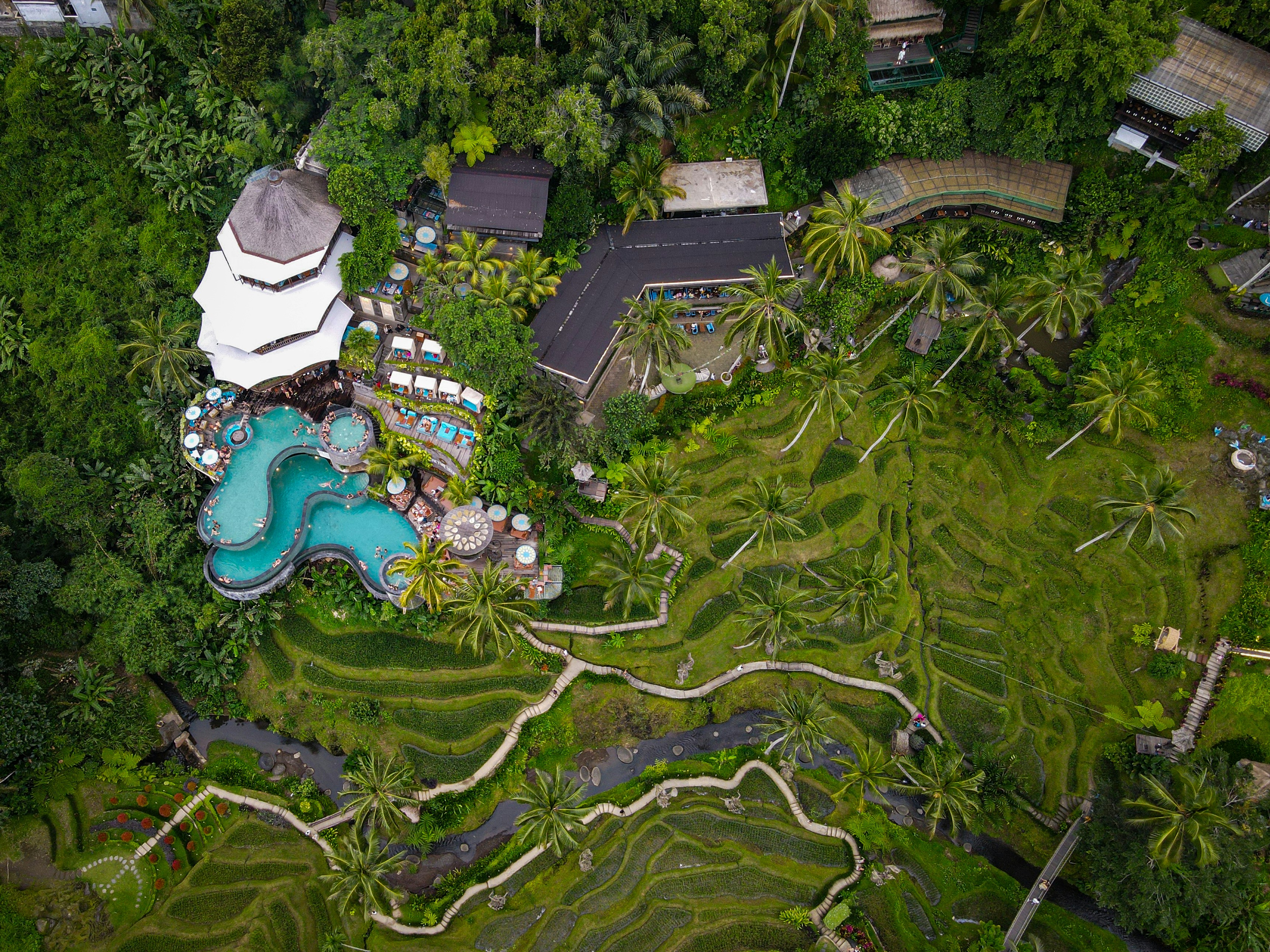 a bird's eye view of a resort surrounded by trees