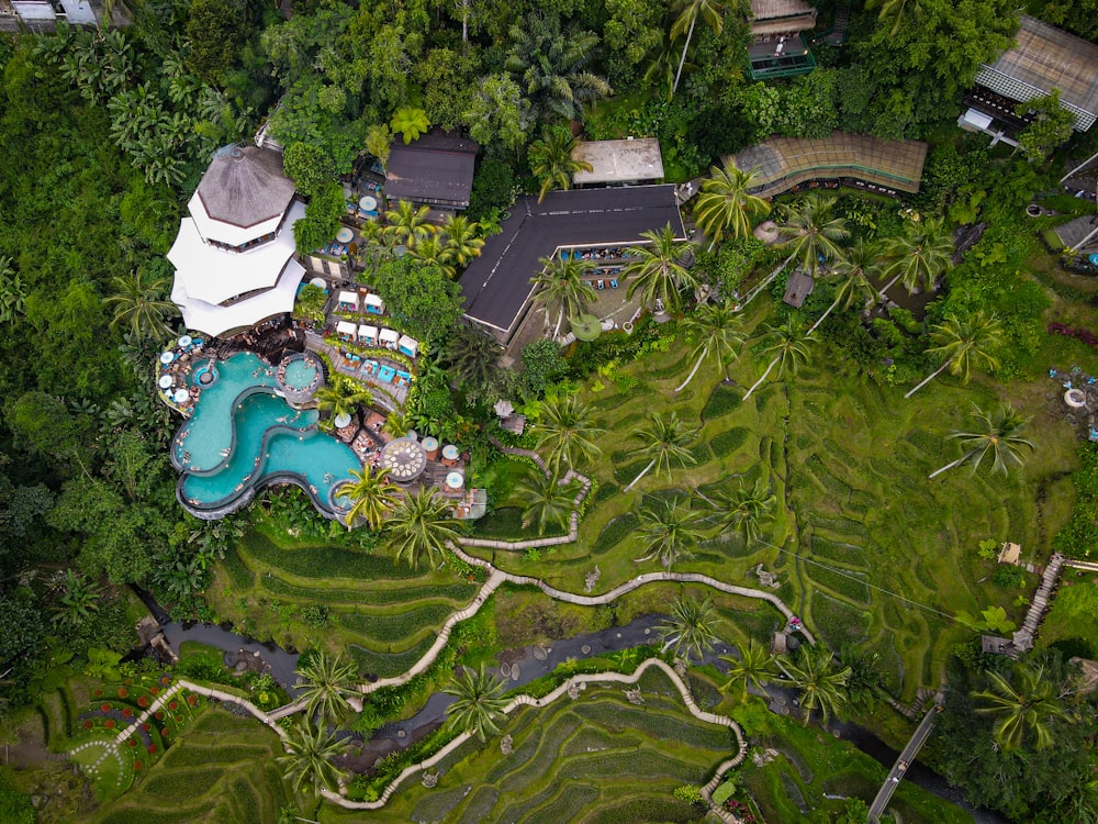 a bird's eye view of a resort surrounded by trees