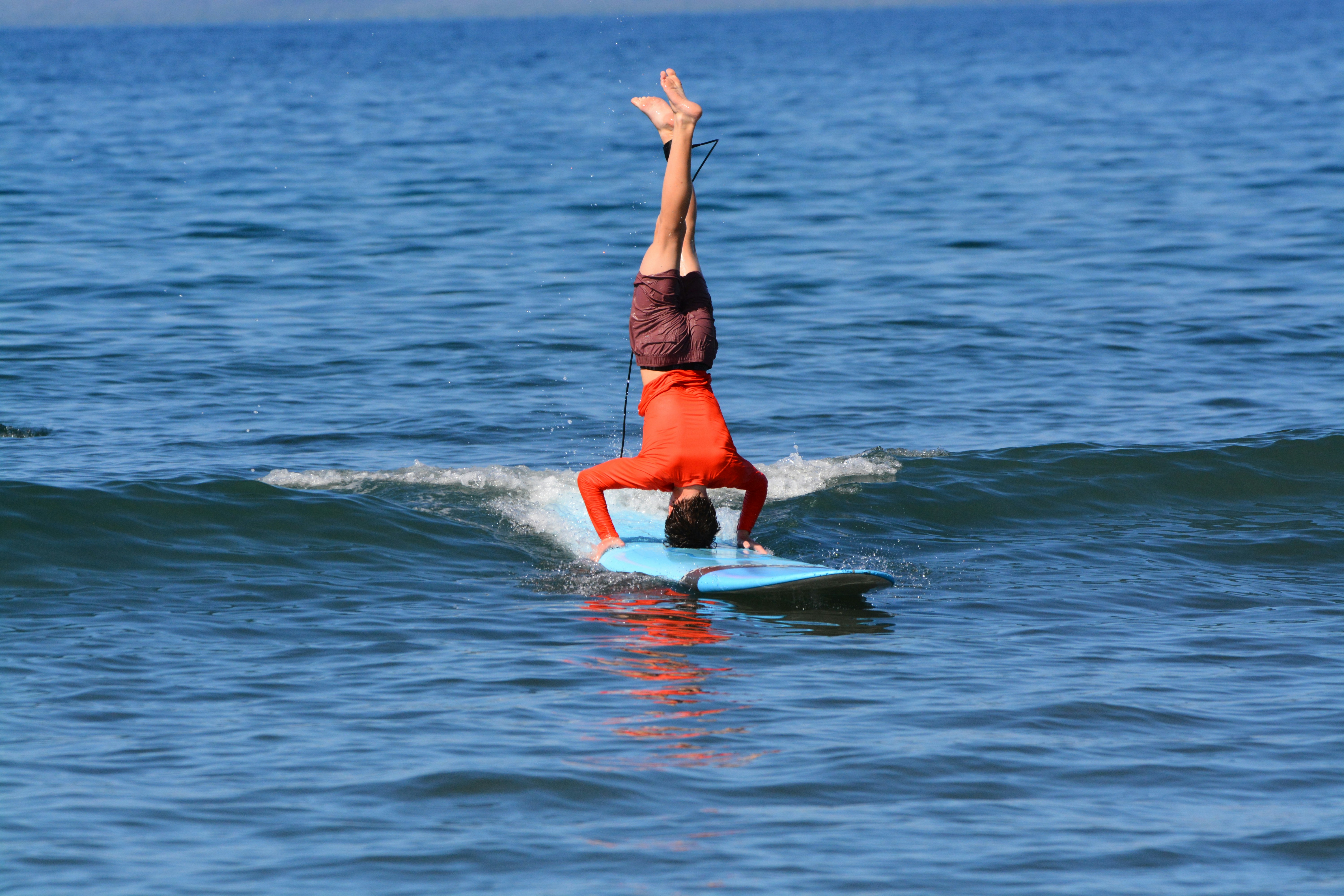a person riding a surf board on a body of water