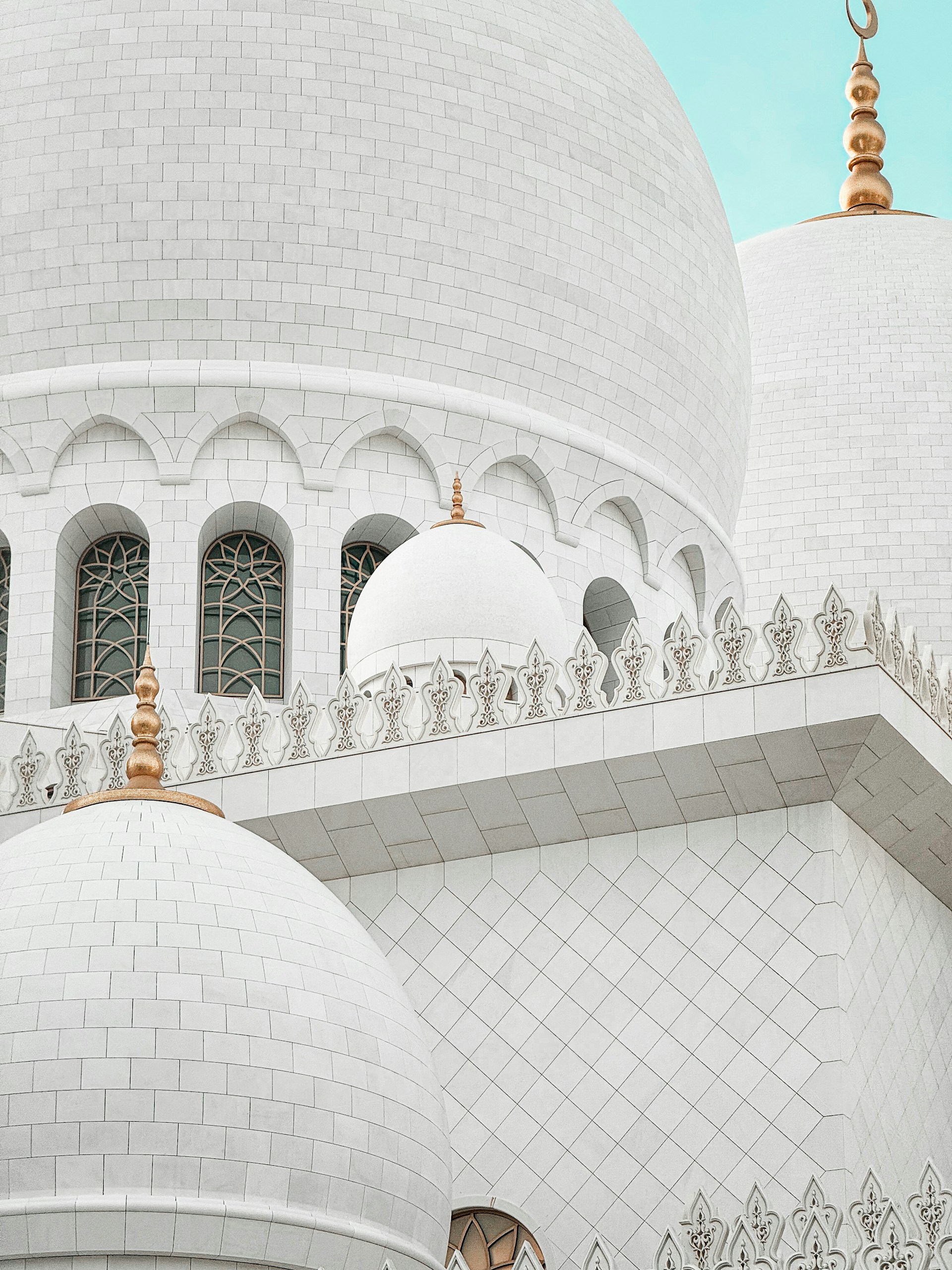 a large white building with a clock on it's side