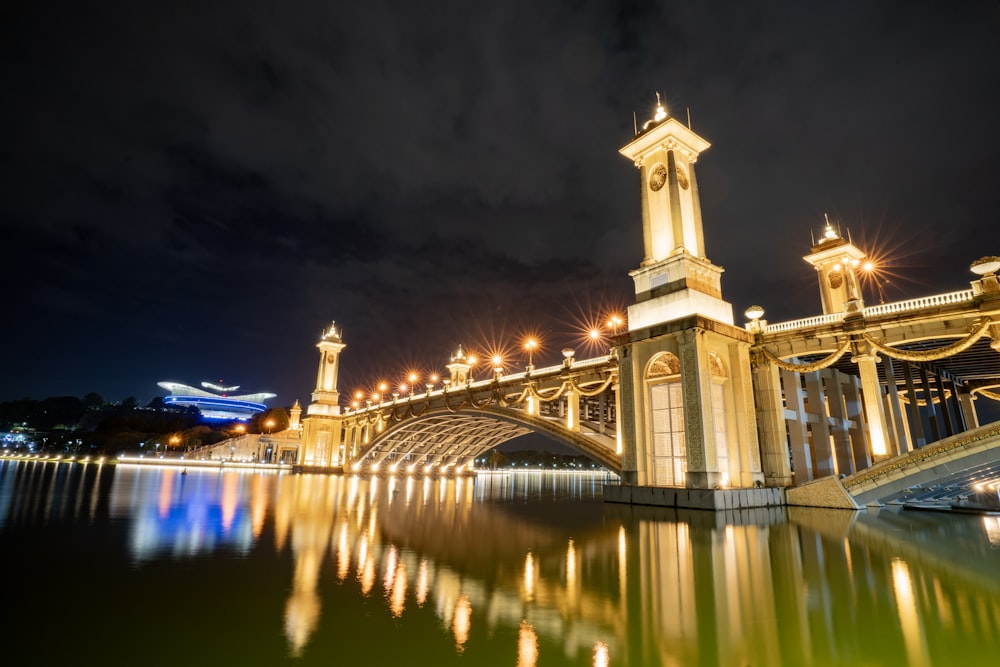 a bridge that has a clock tower on it