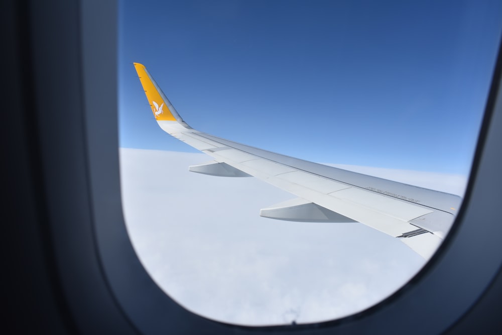 a view of the wing of an airplane through a window