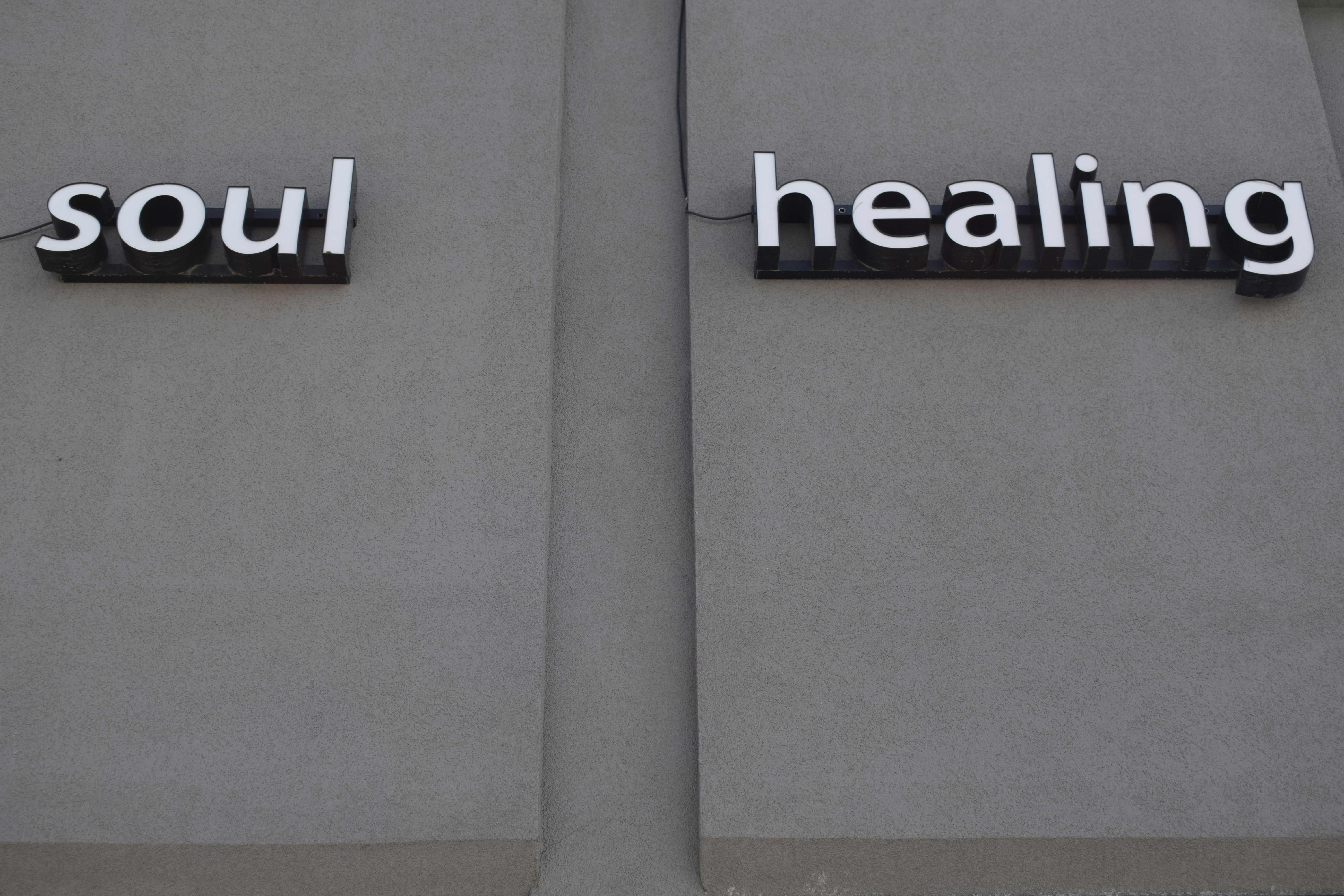 a couple of signs that are on the side of a building