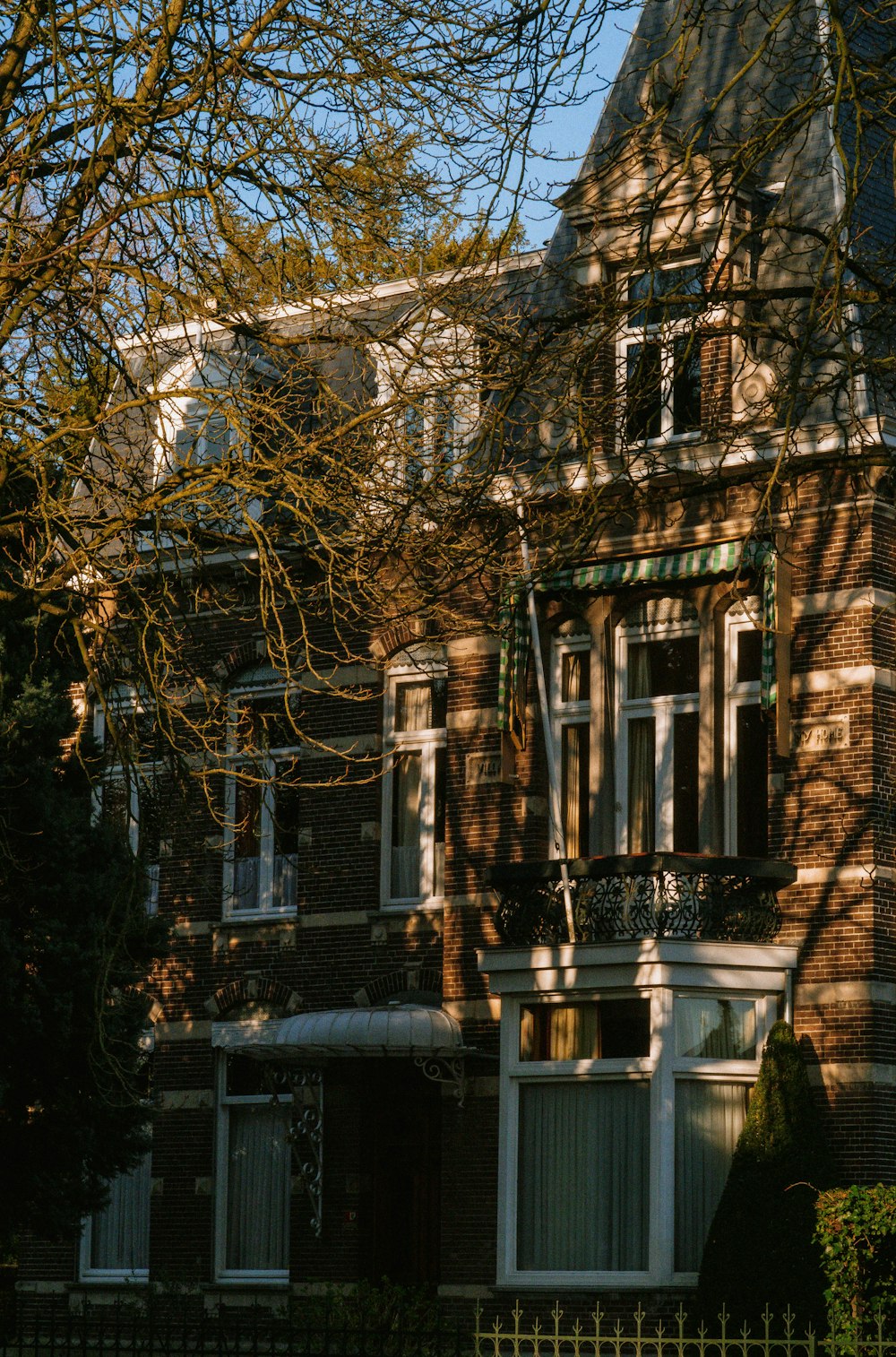 a large brick building with a clock on the front of it