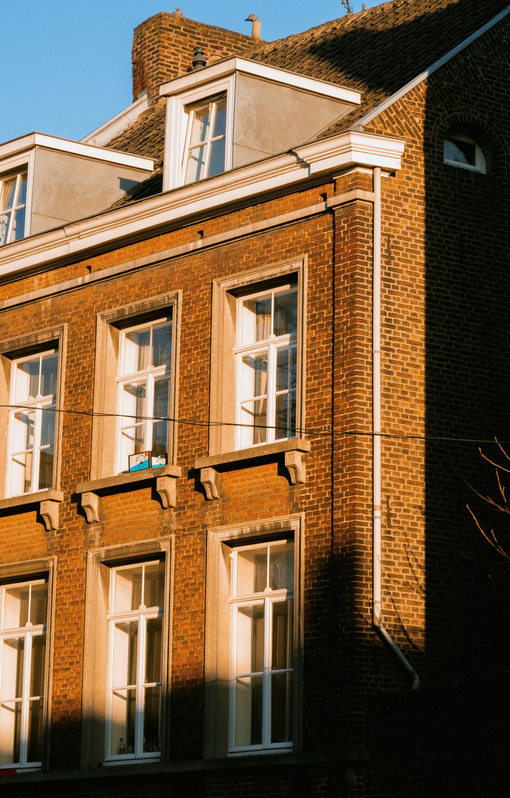 a tall brick building with lots of windows