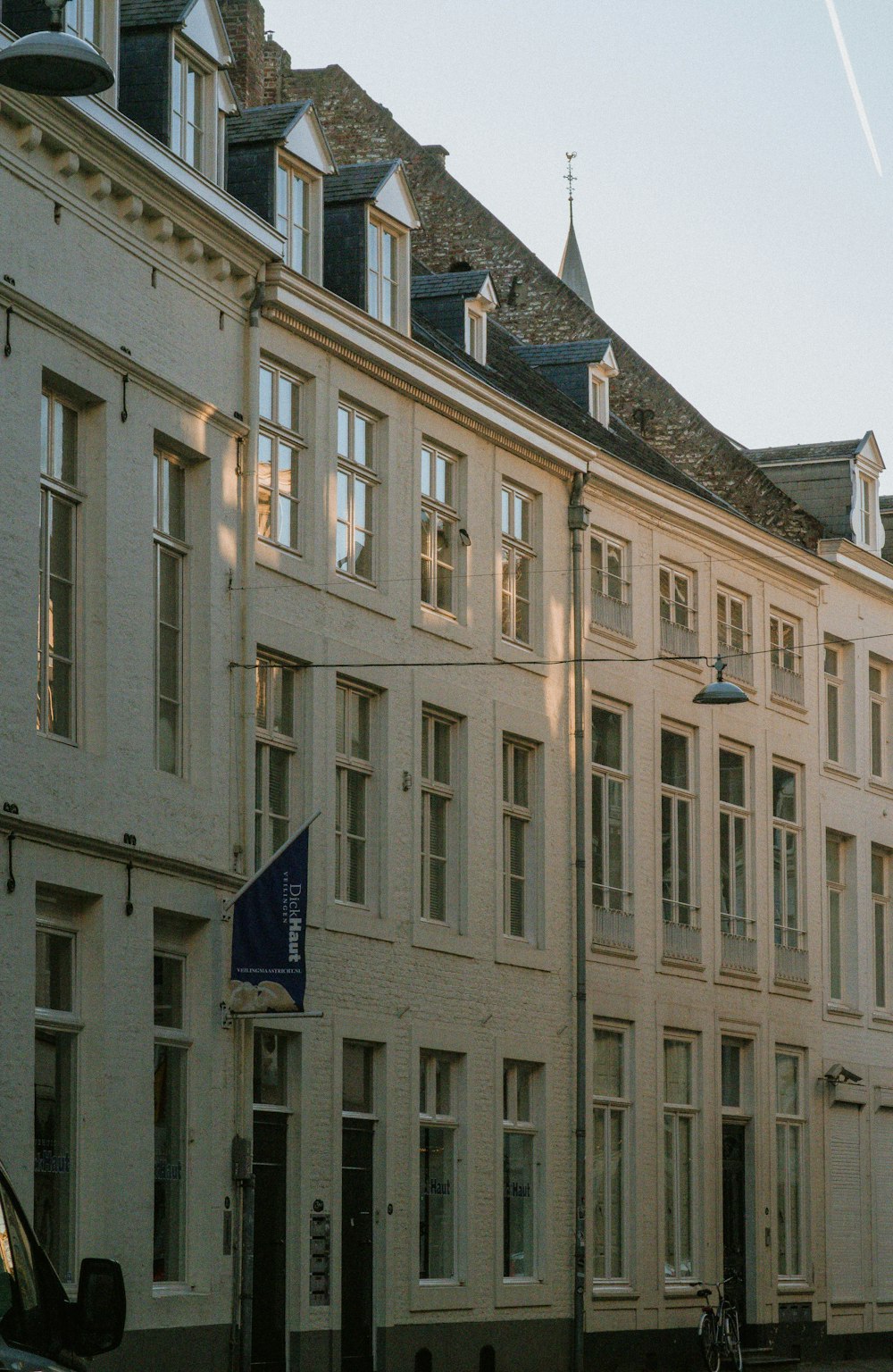 a row of white buildings on a city street