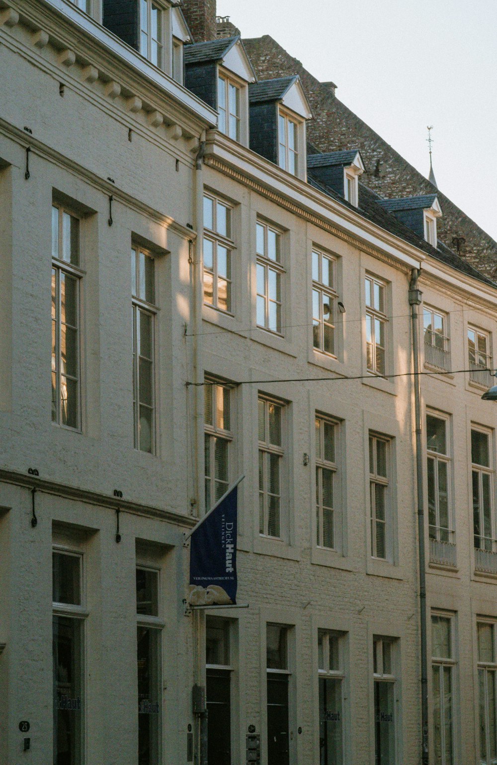 a row of buildings with a street sign in front of them