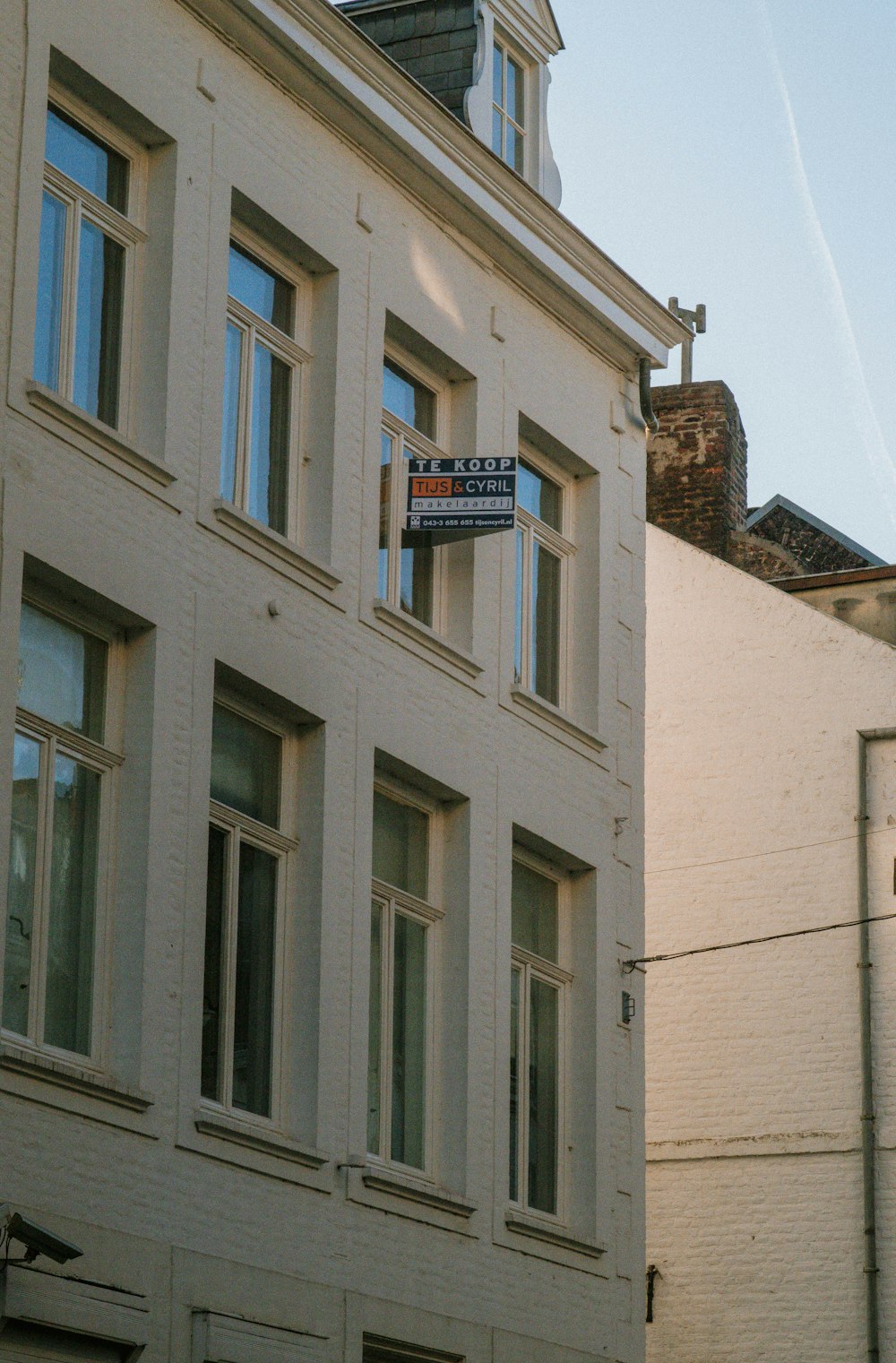 a building with a street sign in front of it