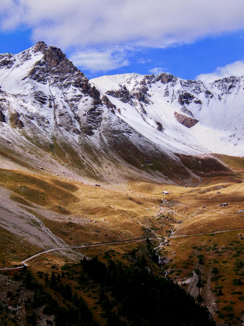 a view of a mountain with a road going through it