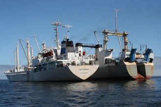 a large boat floating on top of a body of water