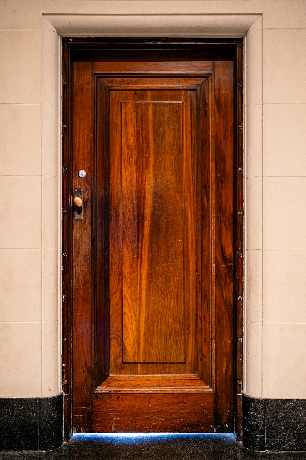 a wooden door on the side of a building