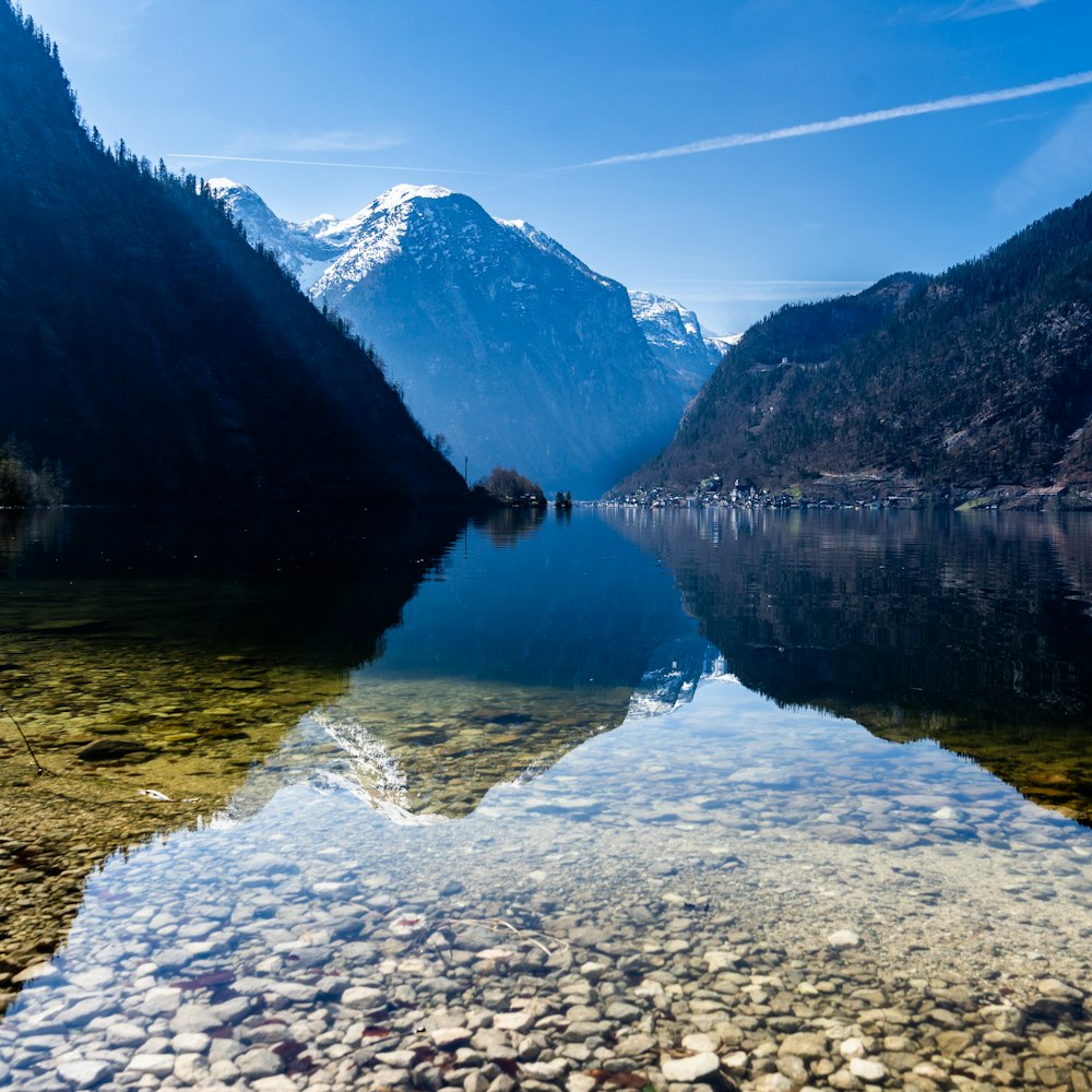 a body of water surrounded by mountains and rocks