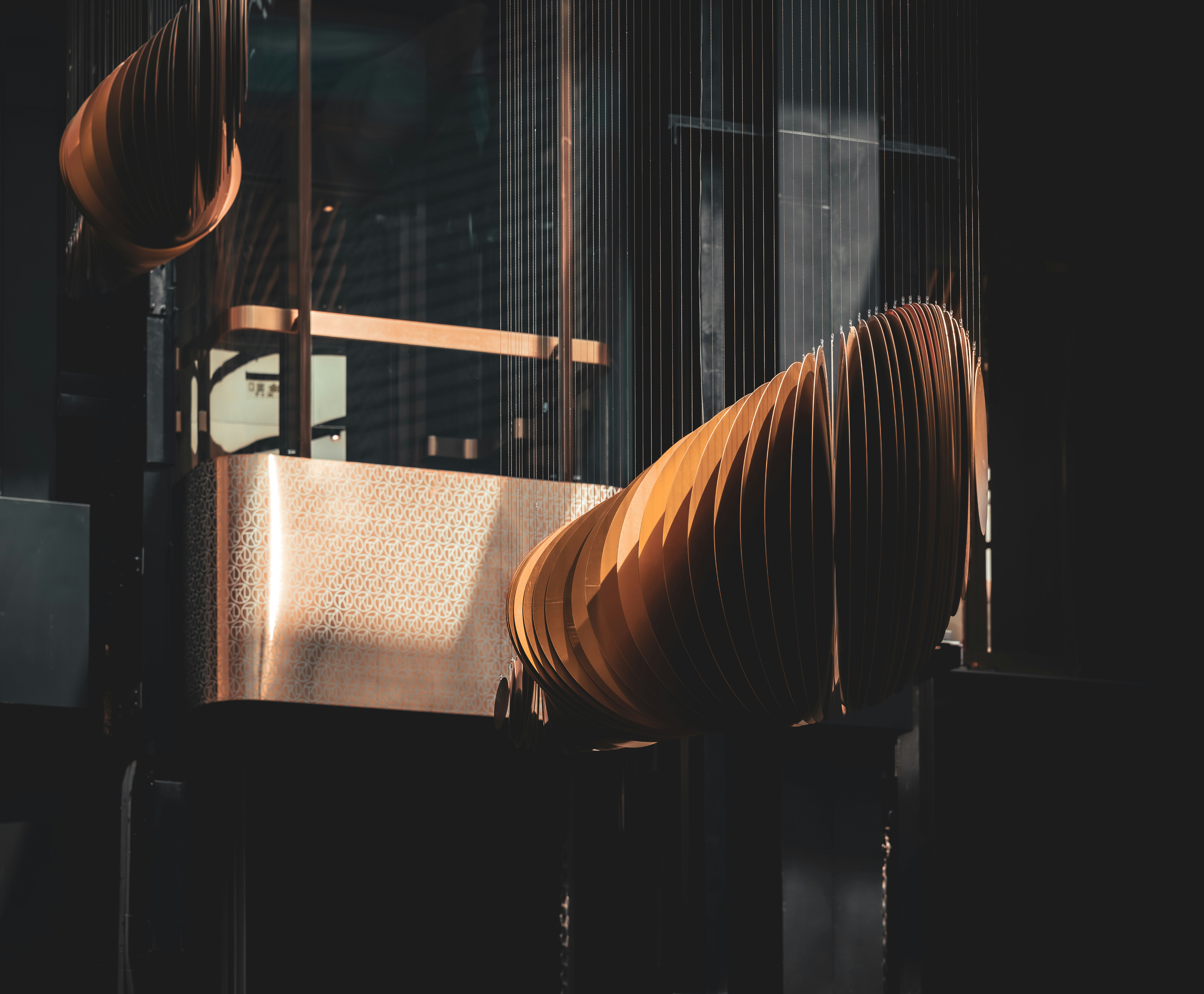 a close up of a metal object in a dark room