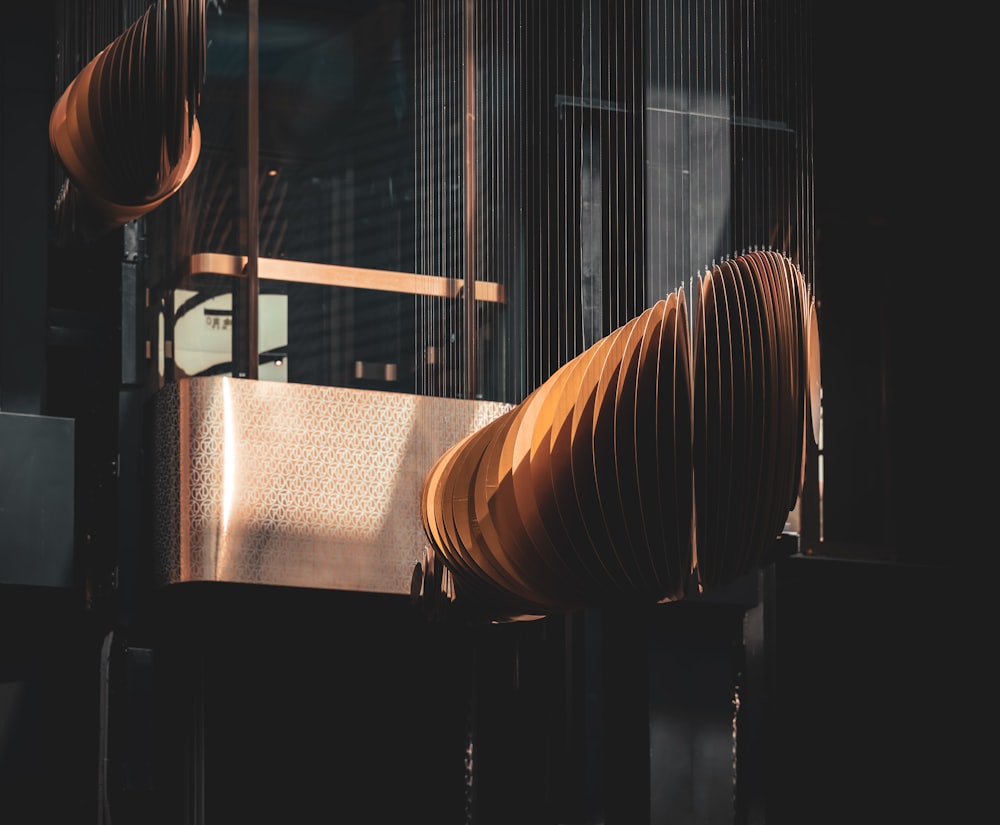 a close up of a metal object in a dark room