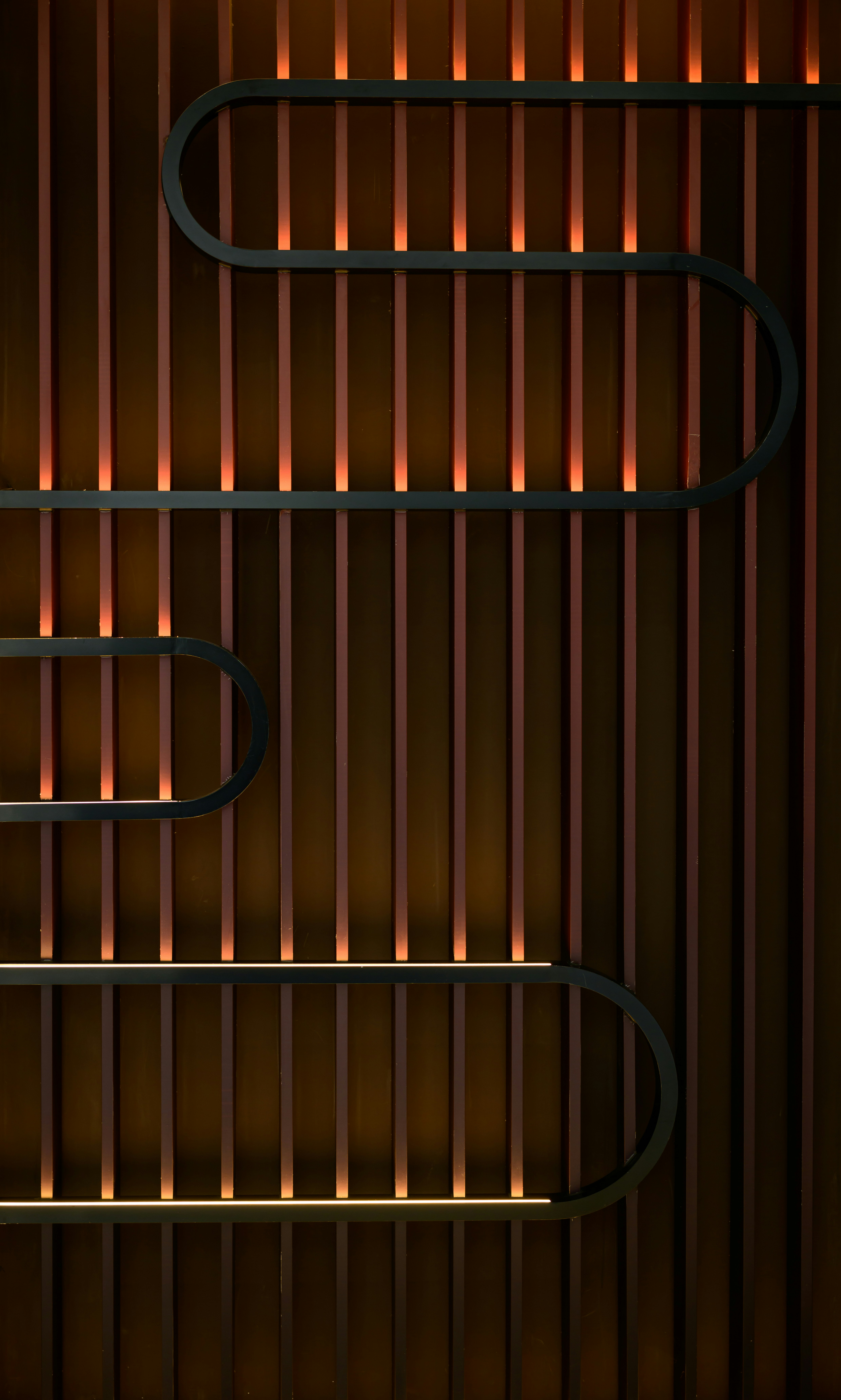 Walls made of curves and straight lines are embedded with light strips