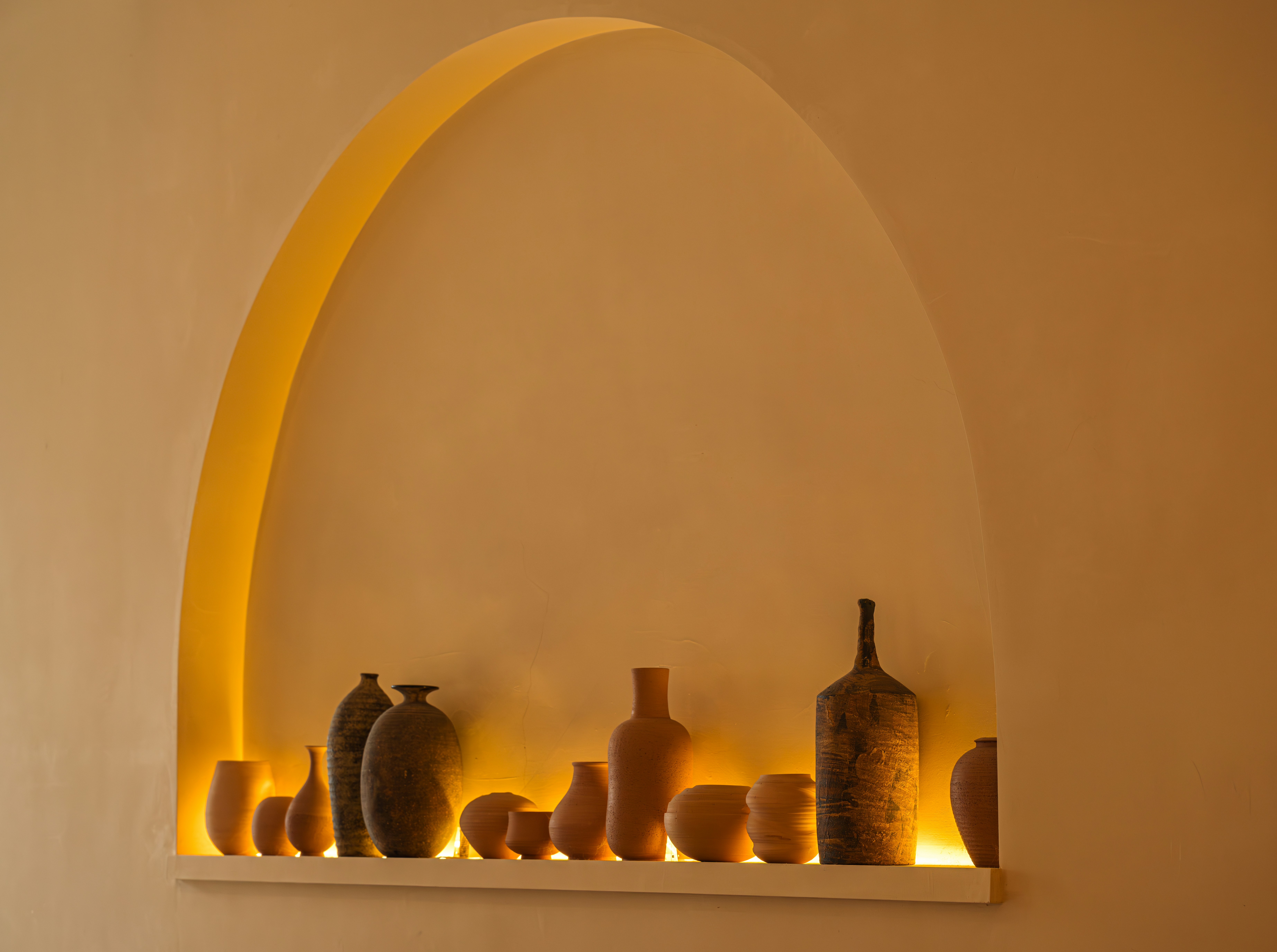 A niche with many clay pots