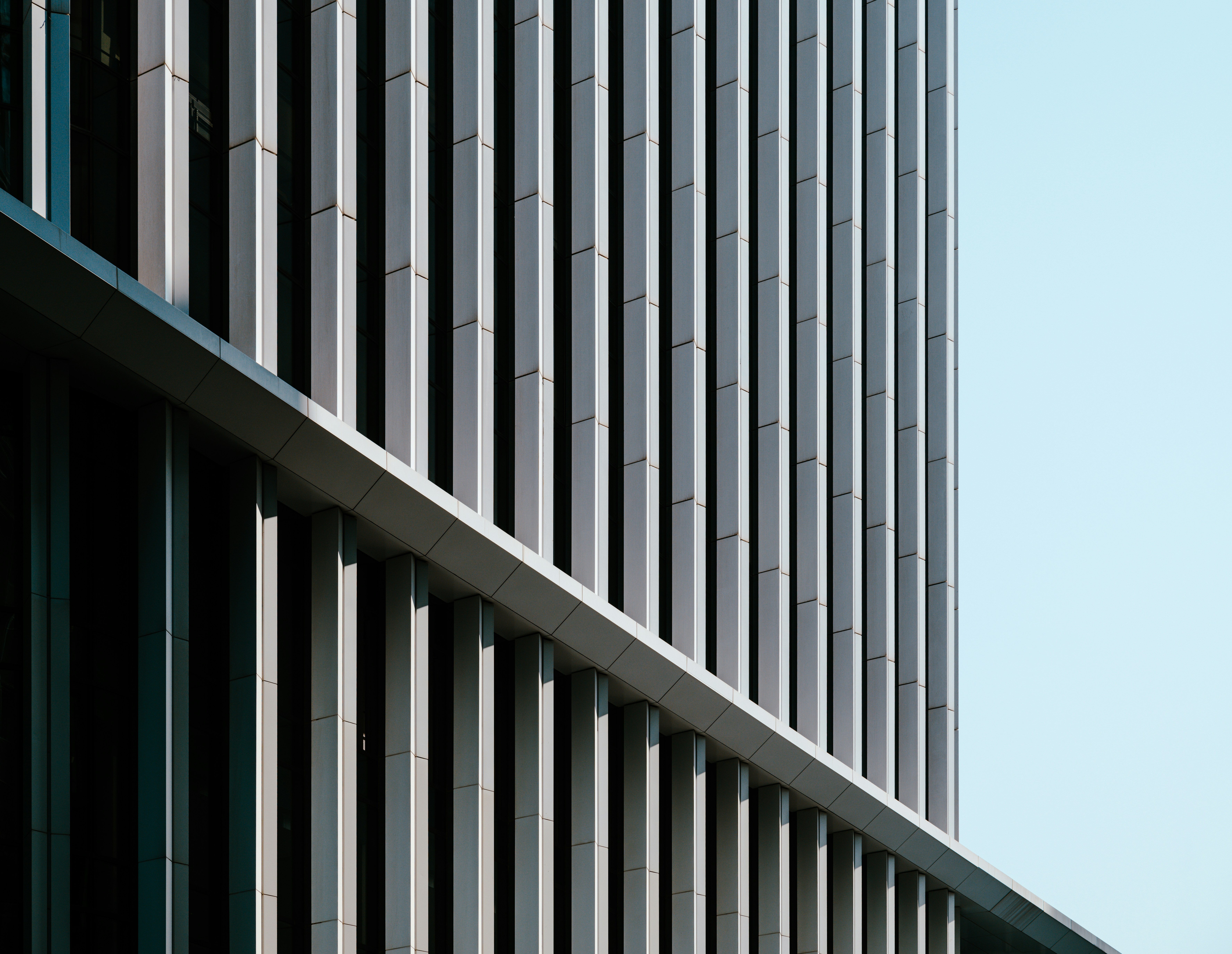 a tall building with a sky in the background