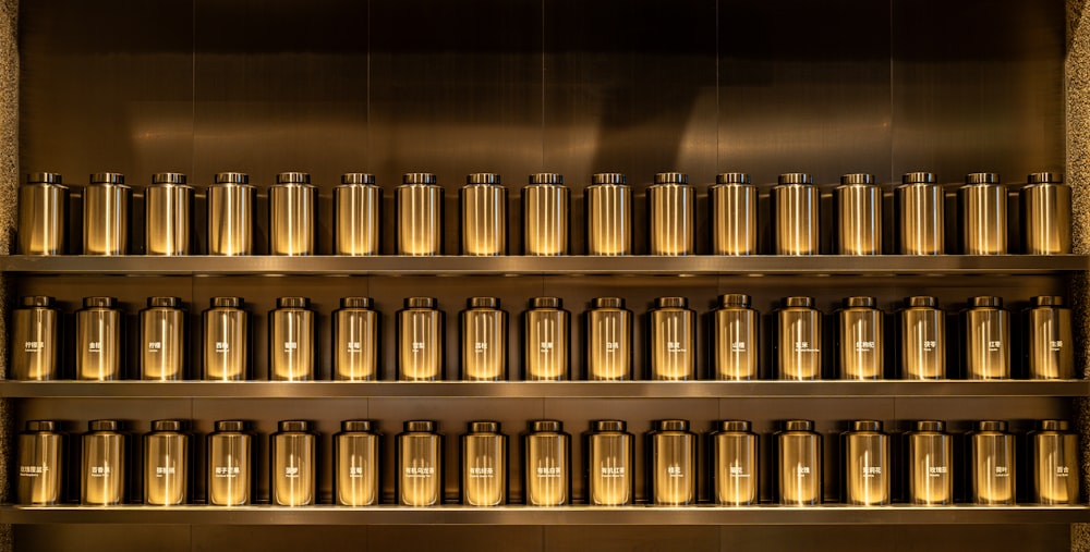 a metal shelf filled with lots of bottles