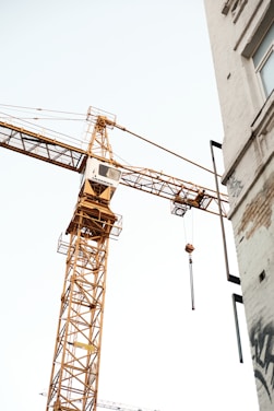 a crane is attached to the side of a building