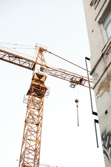 a crane is attached to the side of a building