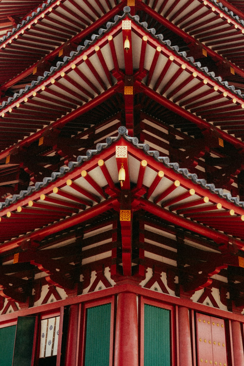 a tall red building with a clock on top of it