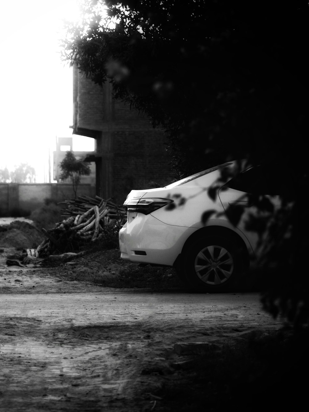 a white car parked in front of a house