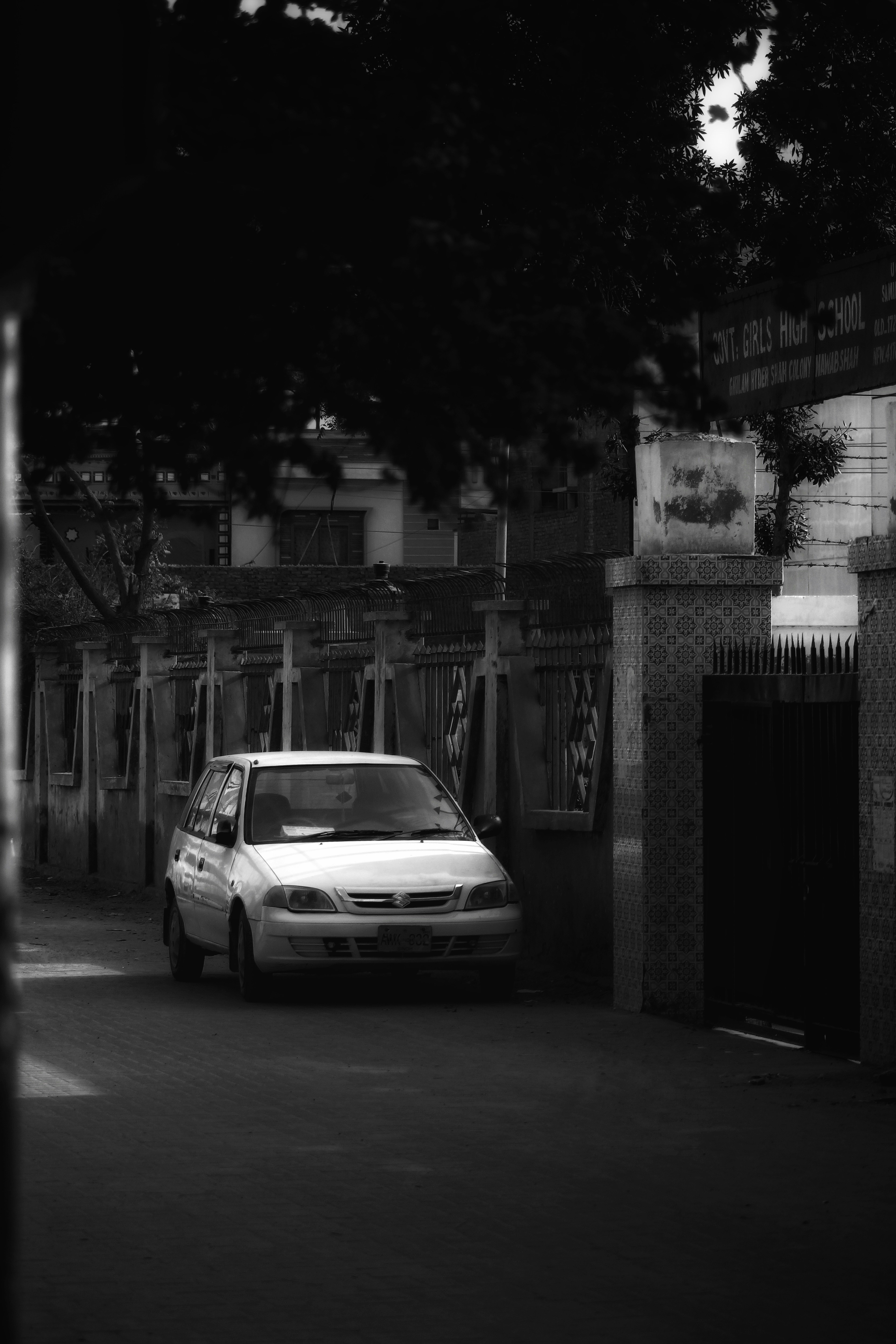 a white car parked on the side of a road