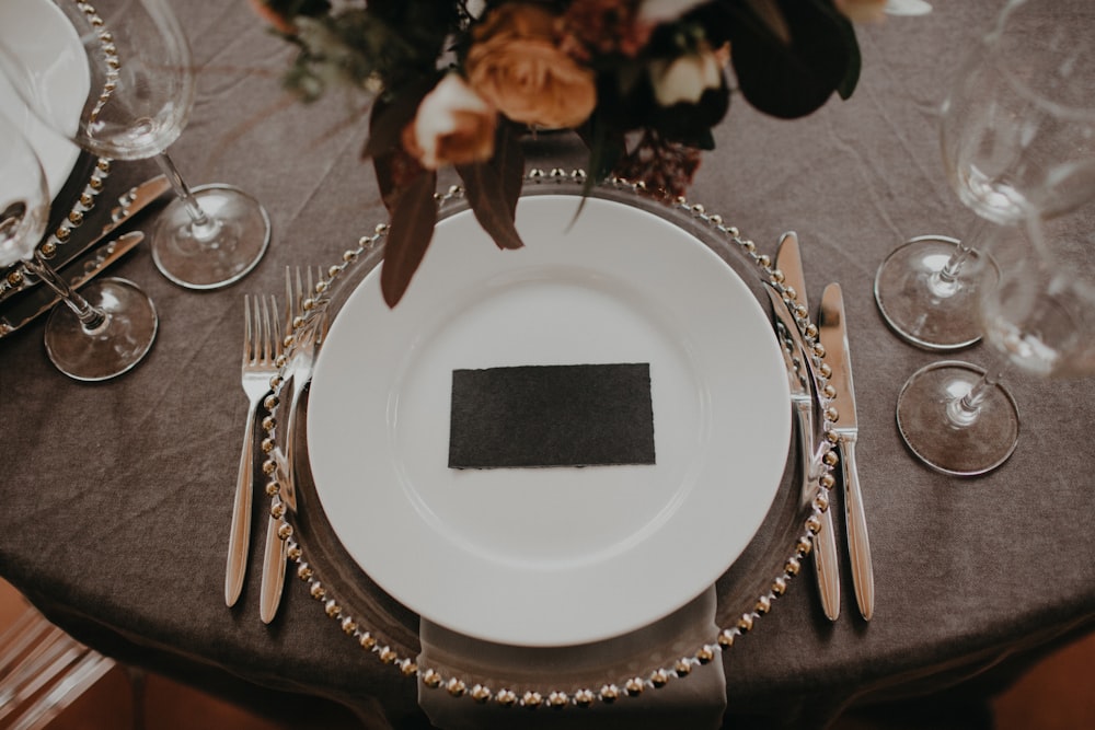 a table set with a place setting for a formal dinner