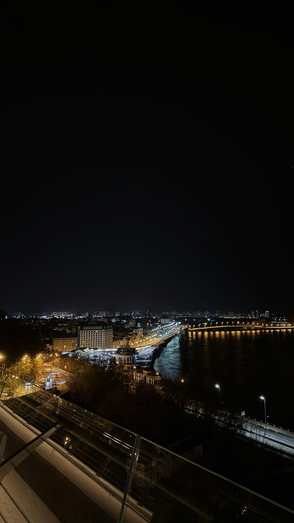 a view of a city at night from a balcony