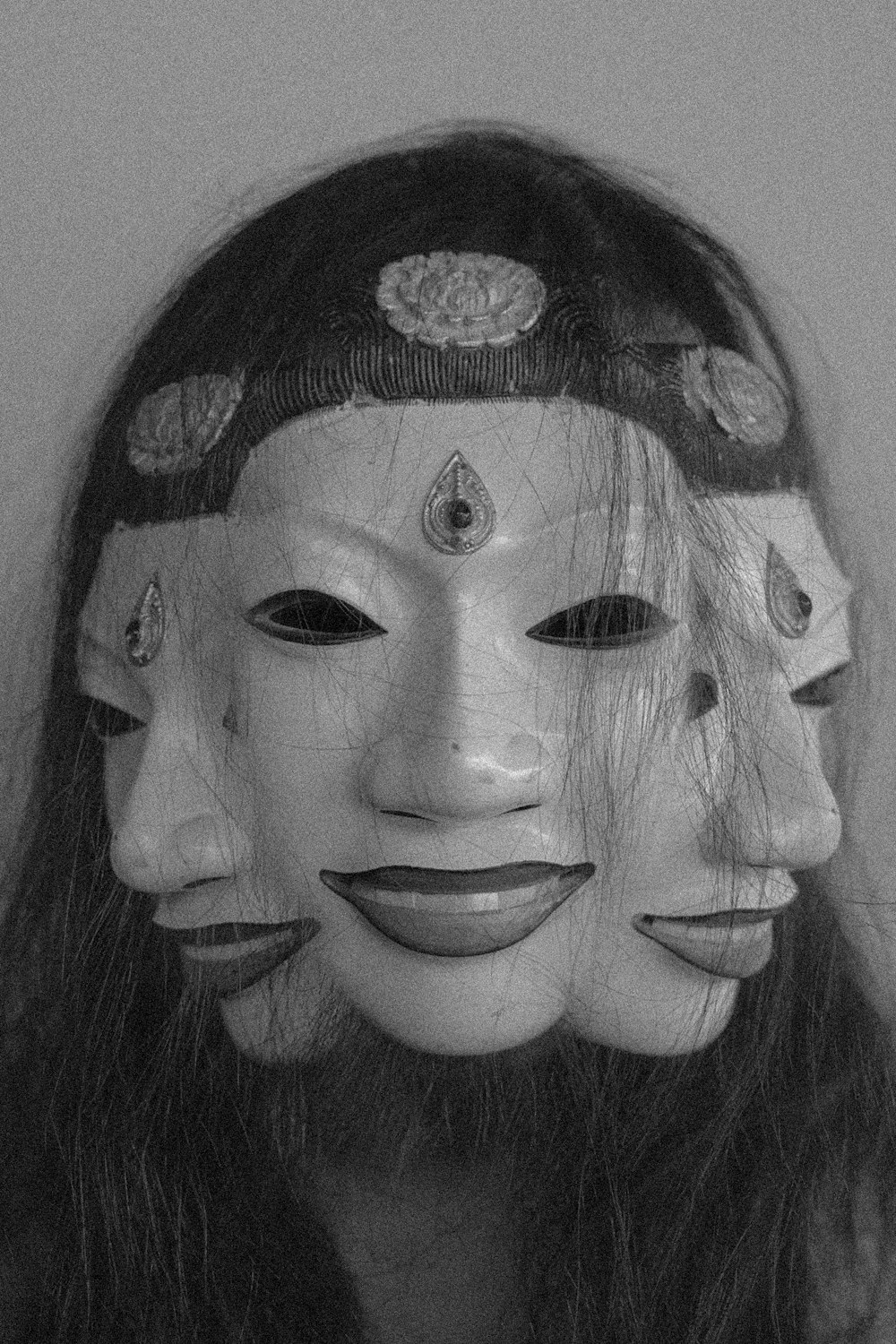 a woman with three masks on her face