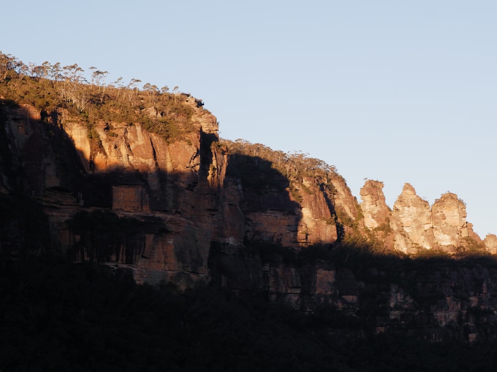 a view of a mountain side with a sky background