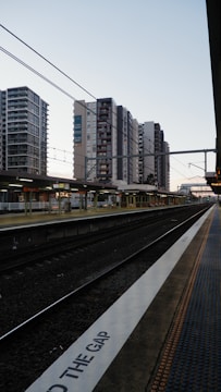 a train station with a train on the tracks