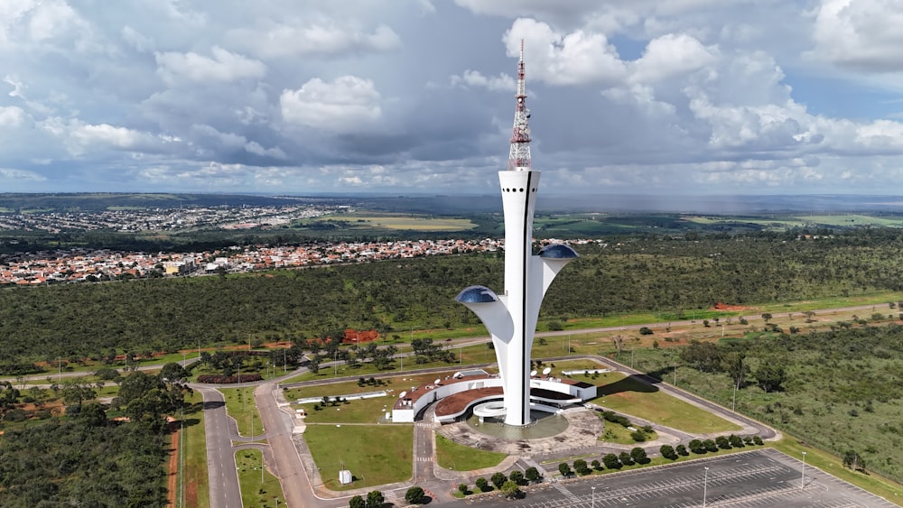 an aerial view of a tall building with a sky background