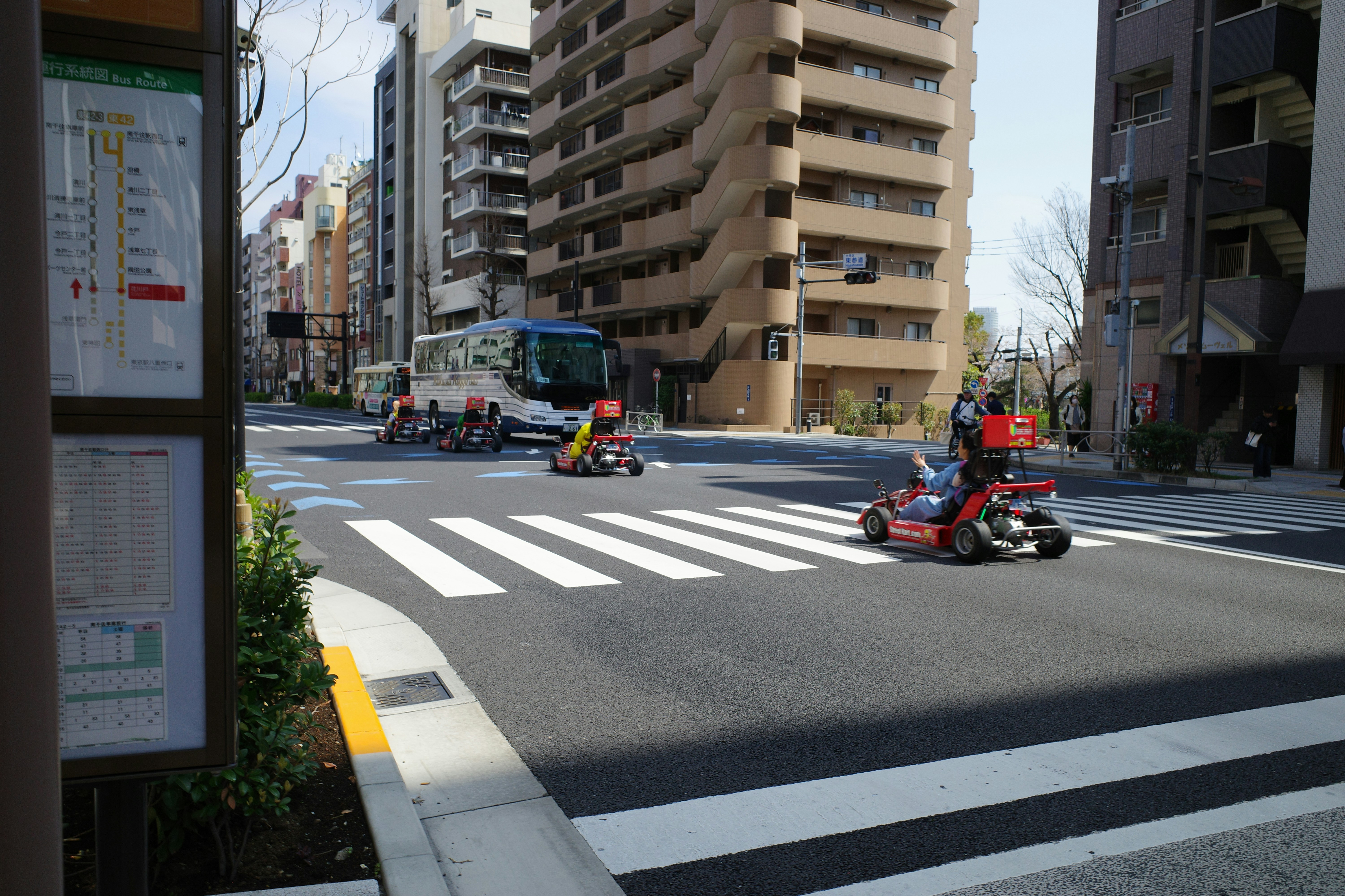 a city street with cars and motorcycles on it