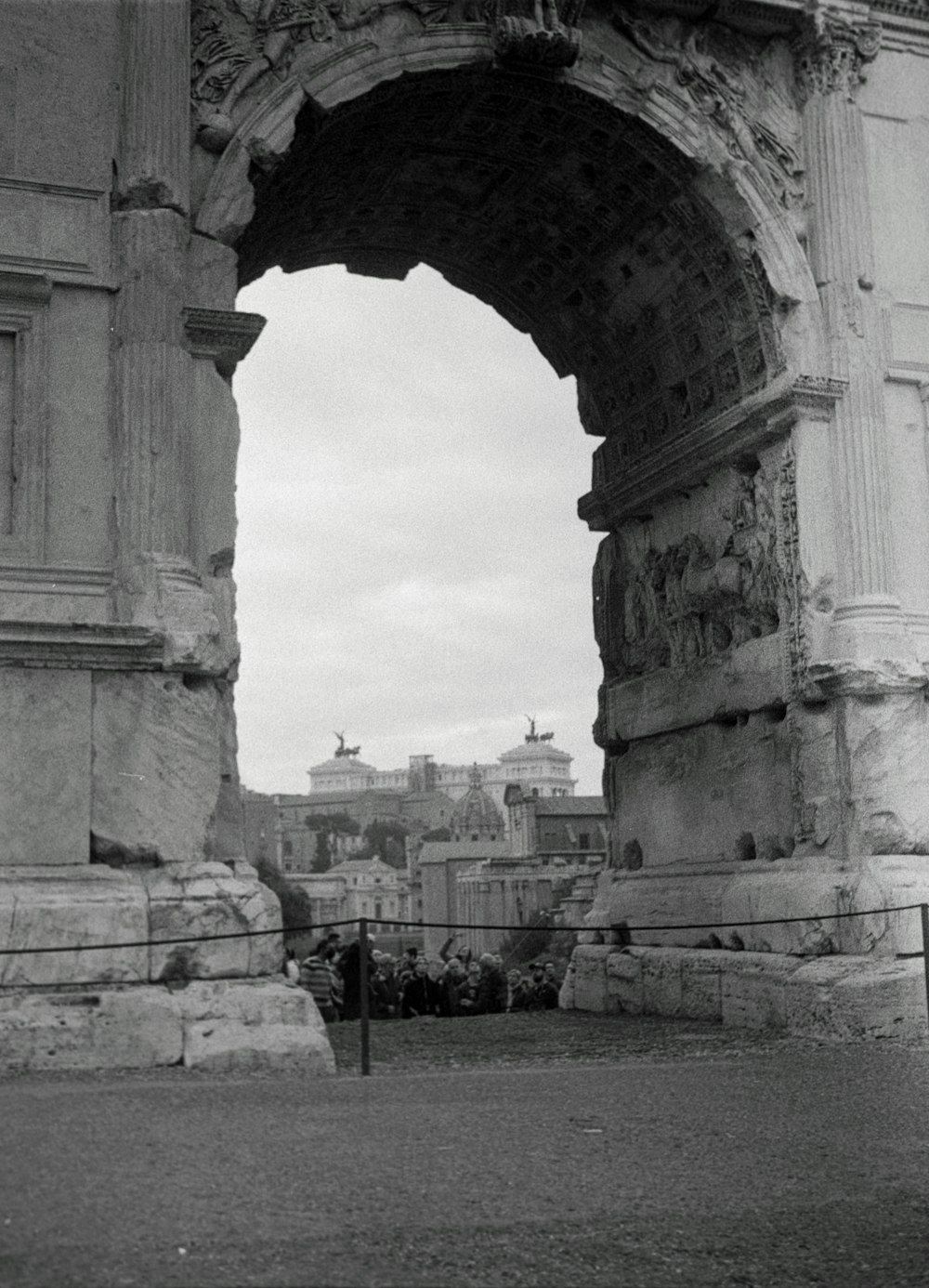 a black and white photo of an arch