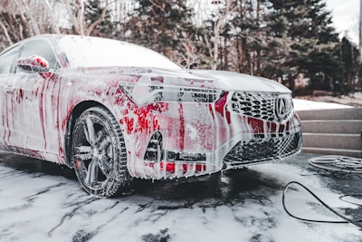 a car is covered in red and white paint