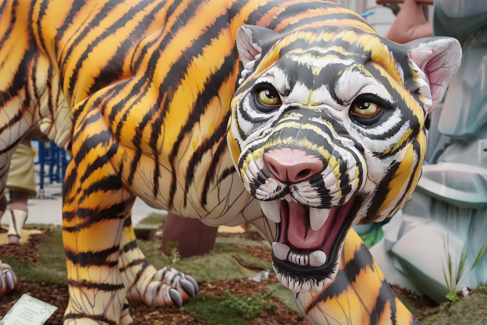 a large tiger statue with its mouth open
