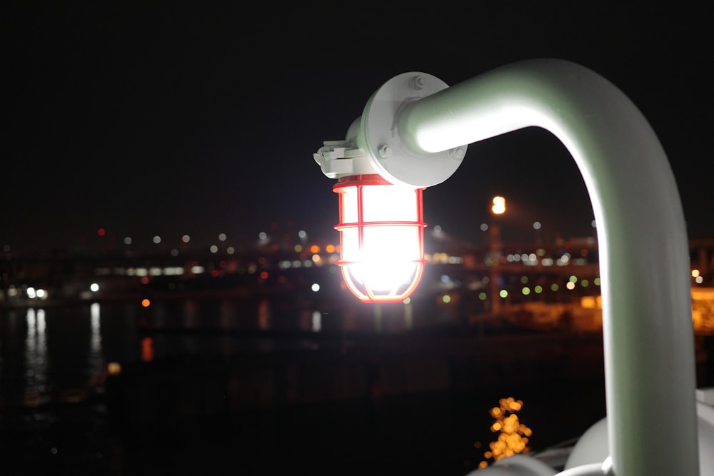 a street light with a city in the background