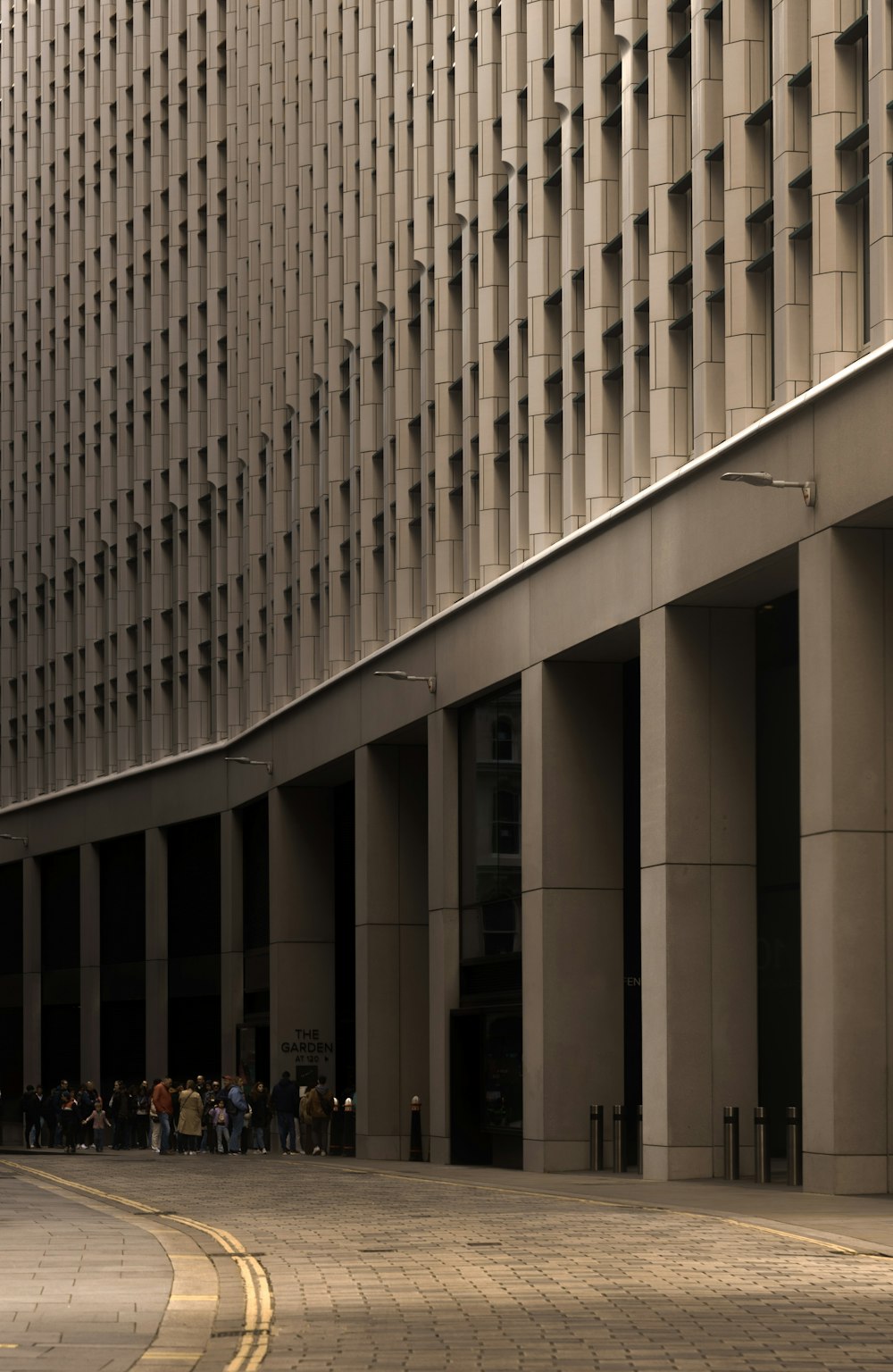 a group of people standing outside of a building