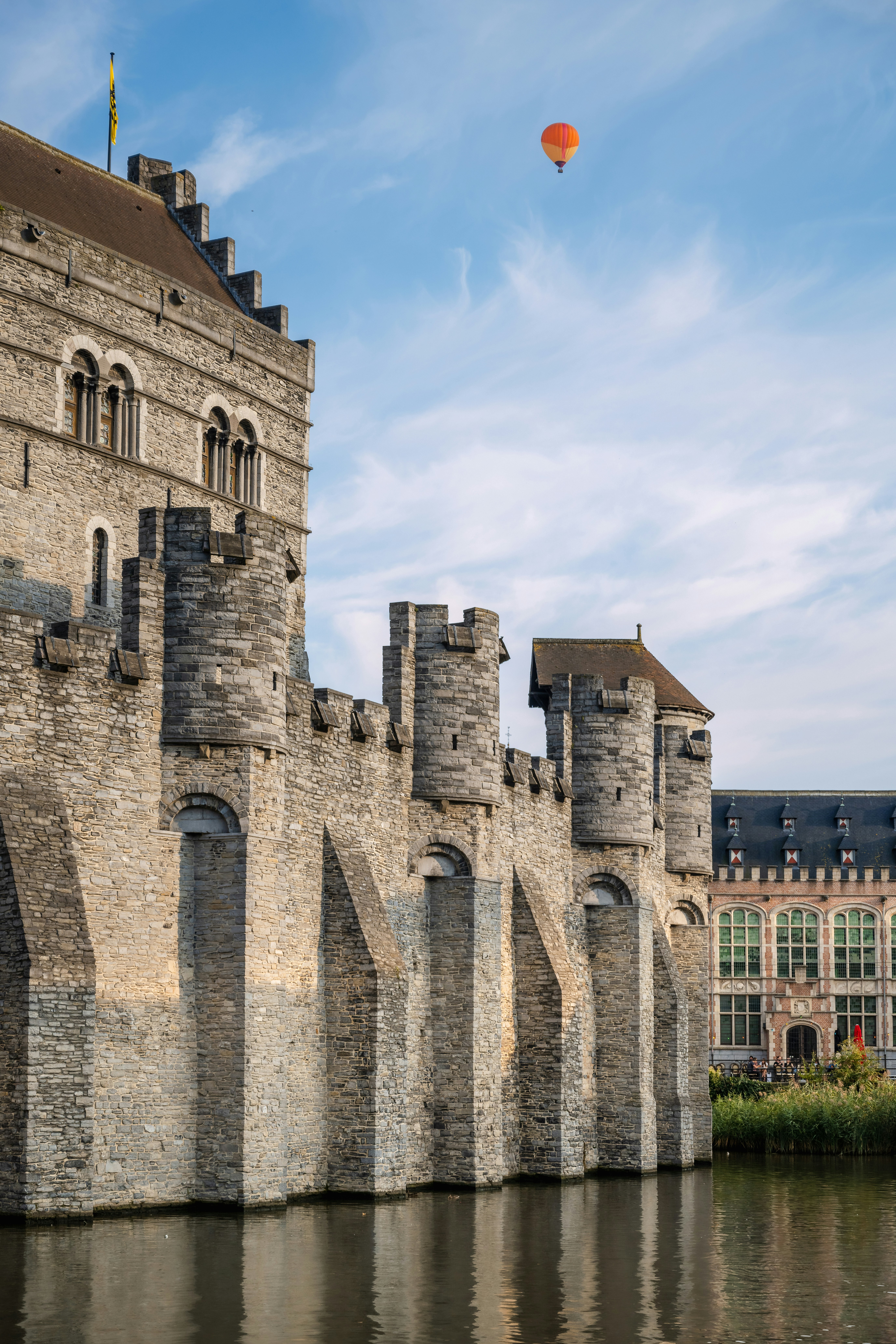 woman wearing yellow long-sleeved dress under white clouds and blue sky during daytime
