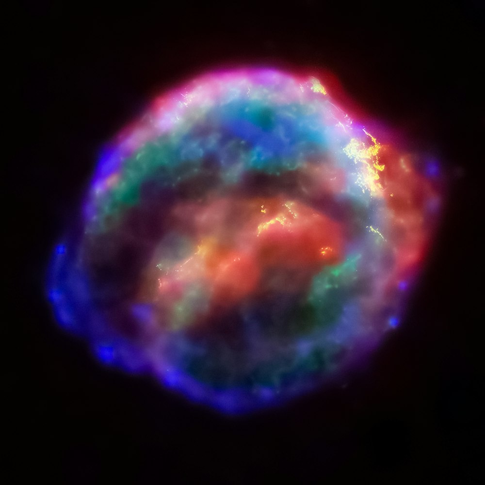 a very colorful object in the dark sky