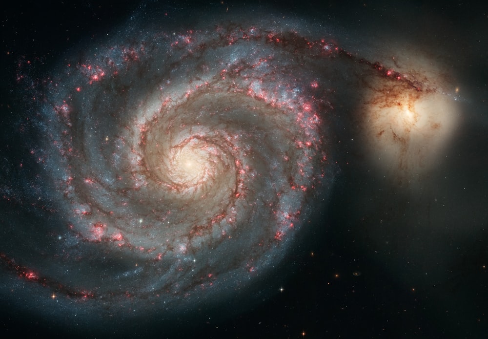 two very large spiral shaped objects in the sky