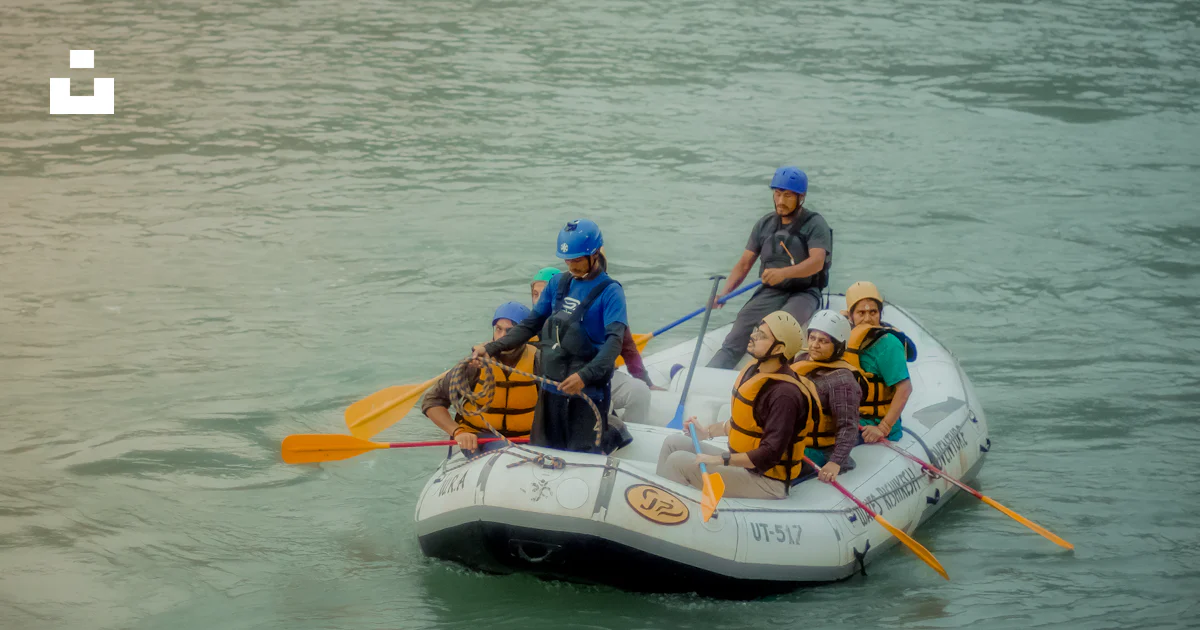 Person Riding Raft A group of people riding on the back of a raft photo – Free Rishikesh ...