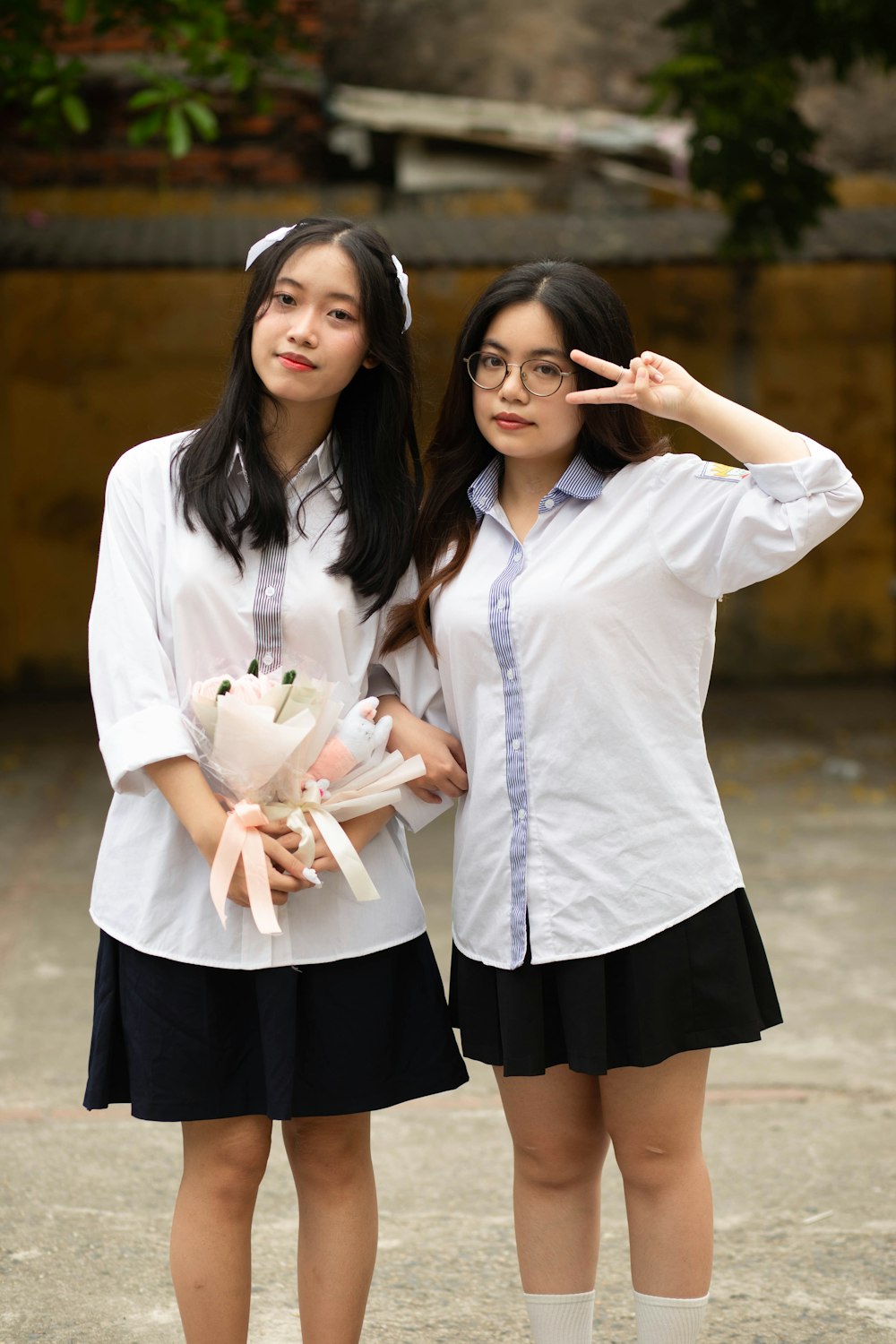 two young women standing next to each other