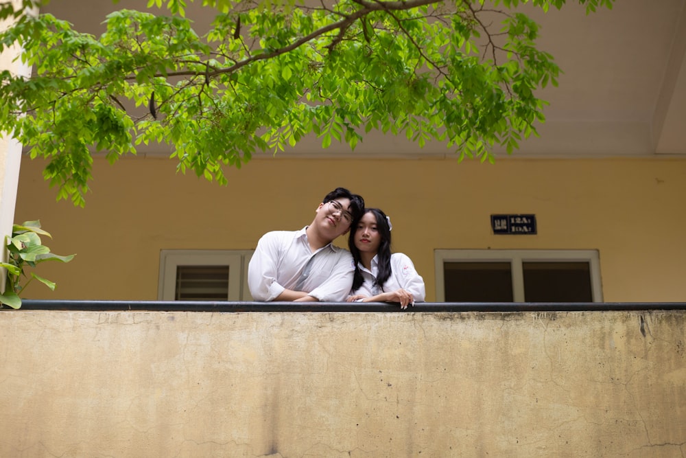 a man and a woman standing next to each other