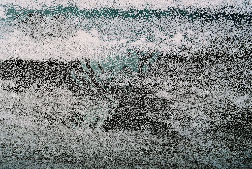 a black and white photo of a wave in the ocean