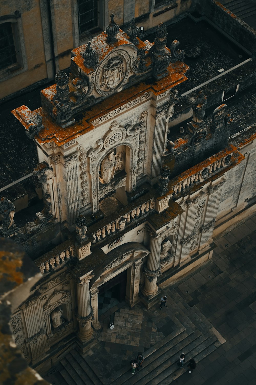 an aerial view of a building with a clock tower