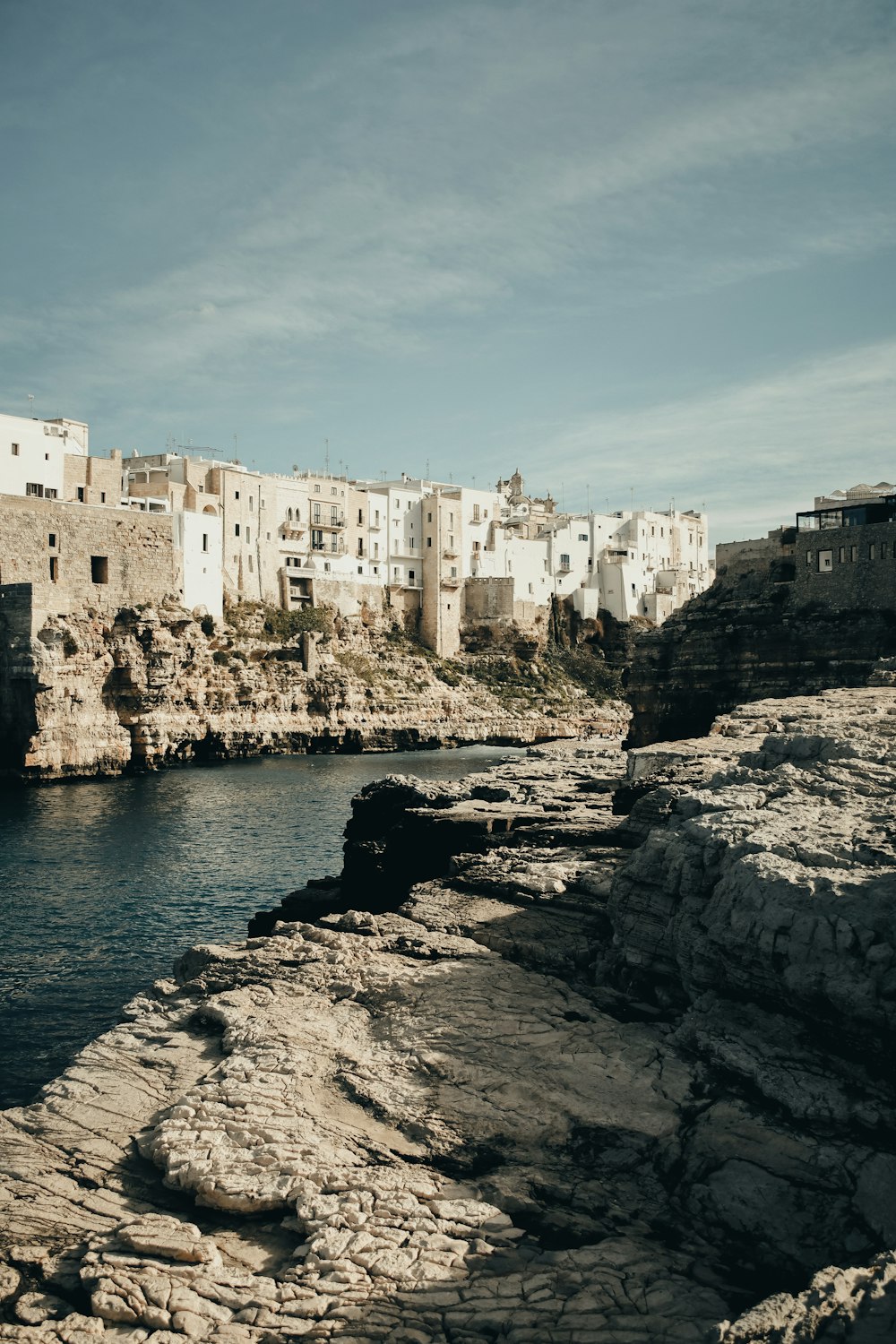 a body of water with a city in the background